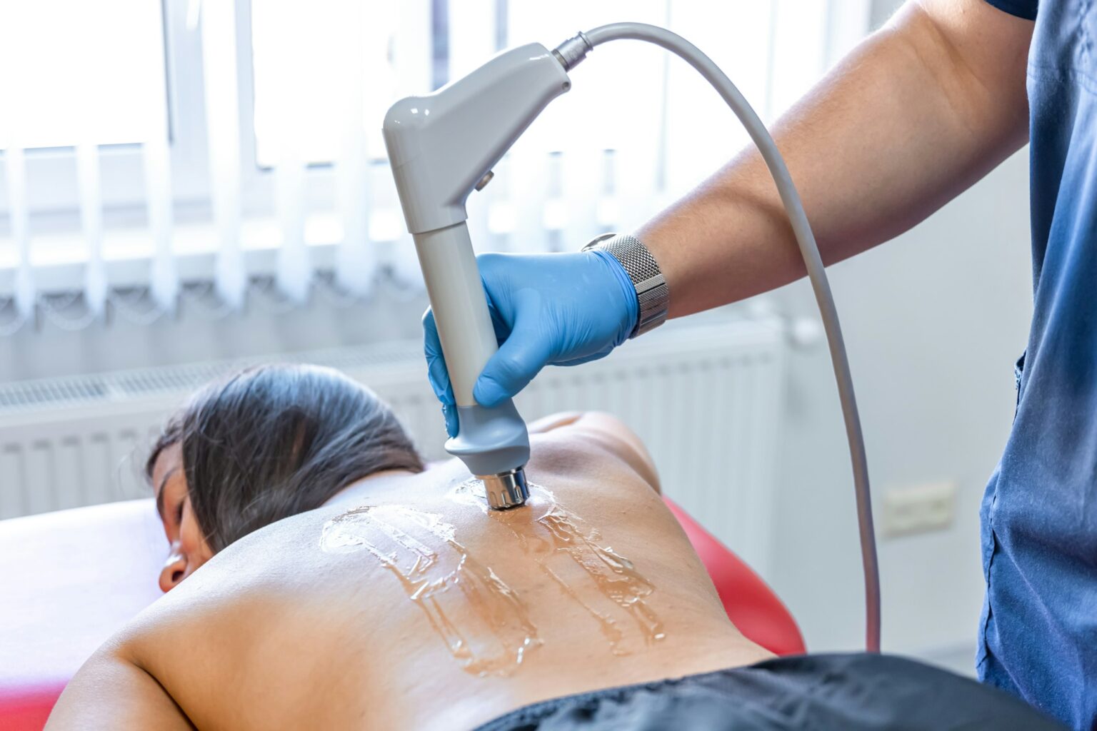 Extracorporeal shockwave therapy, physical therapy for neck and back muscles.